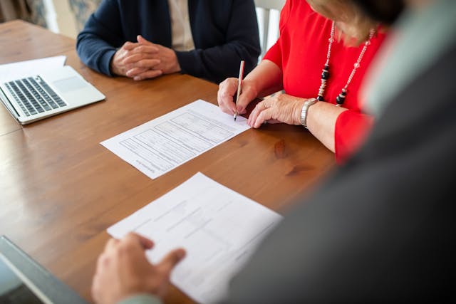 person%20signing%20application%20form